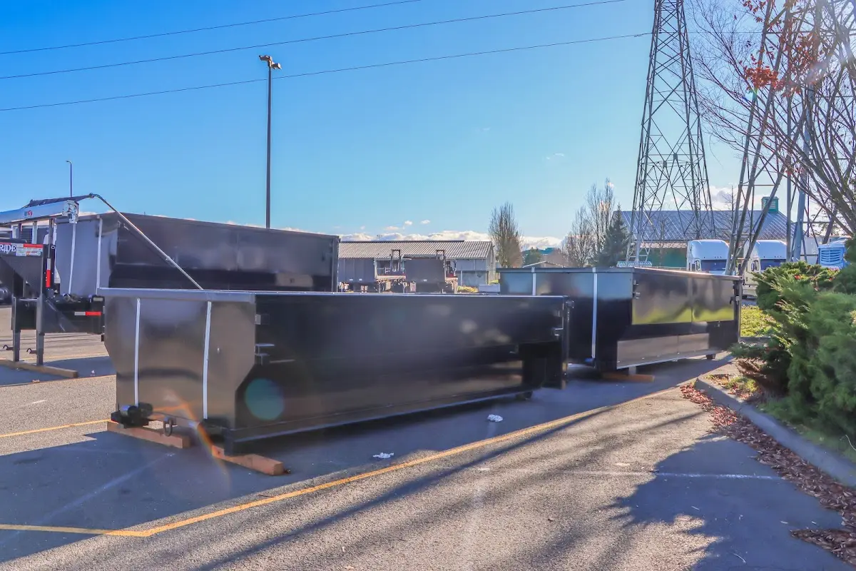 Roll-off dumpster ready for waste disposal at job site for Demolition Dumpster Rental in Fenton